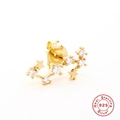 Detailed close-up of a gold-plated S925 sterling silver star earring with sparkling stones - Scorpio / Gold