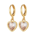 Detail of heart-shaped crystal drop earrings with golden bezels on a white background - White