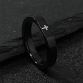 Close-up of a faceted black stainless steel ring with a silver cross on textured stone - US 9 / 4MM Black