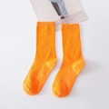 Pair of vibrant orange ribbed cotton blend mid-calf socks for women in candy colors - Bright Orange