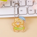 Cute cream yellow bear acrylic keychain with blue polka dot hat and silver bead chain - Dancing Bear