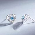 S925 silver heart stud earrings featuring a round blue gemstone with zirconia accents - Dancing Blue Zirconia Studs