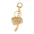 Golden coconut tree keychain with rhinestones and pearls on white background - Gold