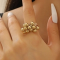 Detailed view of model wearing a chunky gold bead cluster ring with metallic finish - Gold Ring (03 Ring G-308)