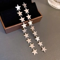 Close-up of long silver tassel star earrings with brushed metal texture and fine chains - 28# Silver Earring Post - Silver