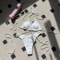 White two-piece bikini with shell chain straps on high-cut bottoms and halter top - S / White
