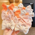 Set of colorful children bow hair ties with floral patterns and gold polka dots - Orange Floral Style (0662-10)