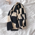 Detail shot of heavy-weight knit checkerboard scarf showing thick wool texture and pattern - Black & White