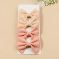 Set of 4 beige and pink waffle fabric bow hair clips for girls on a white card display - Beige/Pink (Set of 4)