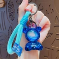 Portachiavi orso spaziale blu galvanizzato con cinturino intrecciato e dettagli BOOM - Blu