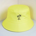 Detailed close-up of black embroidered palm tree on neon yellow canvas bucket hat - One Size / Neon Yellow