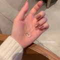 Collana a doppio cerchio intrecciato in finitura dorata con zirconi scintillanti - Oro - Anelli concatenati