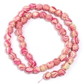 Pink and beige spiral textured wooden beads arranged in a double loop on white background - 10x10mm / Rose Red