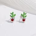 Macro shot of silver cactus stud earrings with green enamel and a red heart detail - Red Heart Strawberry Earrings