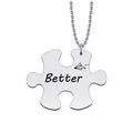 Detailed close-up of a silver puzzle necklace with Better engraving and plane icon - Better Necklace