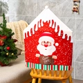 Detail of Christmas chair cover with Santa print and Warm Wishes text in cozy home setting - Santa Claus
