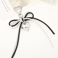 Elegant black and white leather bow keychain with heart pendant and silver swivel clasp - White + Black (K3907)