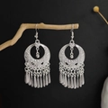 Vintage silver Bohemian flower tassel earrings displayed on a rustic wood branch - Hollow Ring Strip Tassel Style (E6073-28)