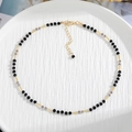 Handmade beaded necklace with black and grey faceted natural stones and gold spacers - Style 7