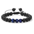 Adjustable woven bracelet with black lava stone beads and blue cat's eye accents - Volcanic + 3 Blue Tiger Eye Beads
