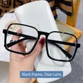 Gafas cuadradas negras de gran tamaño con lentes transparentes y estuche de cuero blanco - Montura Negra Lente Transparente