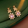 Macro shot of vintage style gold earrings with pink zircon on dark green velvet - Copper/Zircon/925 Sterling Silver Earring Post / Earrings / Gold-Pink