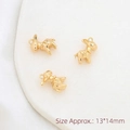 Macro shot of three gold elephant pendants featuring vintage patterns, size 13x14mm - Donkey