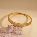 Detail of 18k gold plated hollow flower bangle with sparkling cubic zirconia insets - Gold (18K Gold Plated)