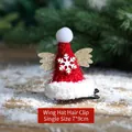 Plush red Santa hat hair clip with gold glitter wings and white snowflake detail - Wing Hat Hair Clip