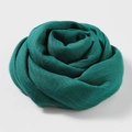 Elegant emerald green cotton linen scarf rolled in a delicate rose shape - Dark Green