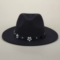 Detailed close-up of a black wool fedora featuring white floral accents and silver rivets - M (56-58cm) / Black