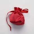 Red satin drawstring gift bag with silk ribbon closure for cosmetic storage - Red