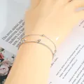 Dettaglio macro del bracciale argento a doppio strato con stella e zirconi cubici - Argento