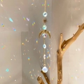 Golden sun and moon crystal suncatcher hanging with faceted prisms for rainbow effect - B7