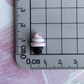 Macro shot of 1.5cm pink ice cream resin charms on a measuring grid for DIY crafts - 03-Black Pink Spiral Ice Cream