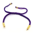 Detail of a handmade purple braided bracelet with adjustable golden bead closures - Purple