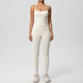 Close-up of ivory high-waist yoga leggings and camisole sports set on a model - Light Ivory