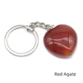 Polished red agate heart-shaped keychain with silver metal chain on white background - Red Agate