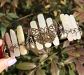 Close-up of vintage bronze headband featuring natural crystals, butterfly and skull motifs - Butterfly Raven Skull Style / Blue and White Jade/Antique Bronze Wire
