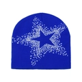 Detalle del gorro de punto azul real con un patrón jacquard de estrella pixelada blanca - M (56-58cm) / Azul Real