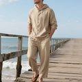 Outdoor shot of men's linen beach set featuring a hooded shirt and loose khaki trousers - Light Khaki