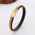 Macro detail of brown and black braided leather bracelet with golden magnetic clasp - Black Brown Stitched Braided