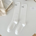 White mid-calf cotton socks featuring black aimin lettering in a minimalist aesthetic - One Size / White