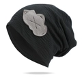 Detail view of black slouchy beanie featuring a cloud patch and ribbed knit texture - One Size / Black