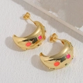 Golden C-shaped earrings with colorful enamel dots on a white marble background - C-Shaped Colorful Earrings