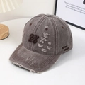 Detailed macro shot of vintage brown distressed baseball cap with embroidery - Dark Brown