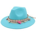 Detail of bohemian turquoise fedora with ethnic woven band, tassels and shell charms - Lake Blue