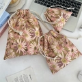 Three sizes of olive green daisy canvas drawstring bags for travel and skincare storage - Pink Daisy