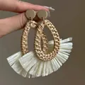 Detailed shot of handmade bohemian gold studs with woven raffia tassel and natural fiber - Gold Rattan Woven Fan Tassel (6#)