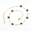 Golden stainless steel anklet featuring multiple woven black bead flower charms - Black Necklace